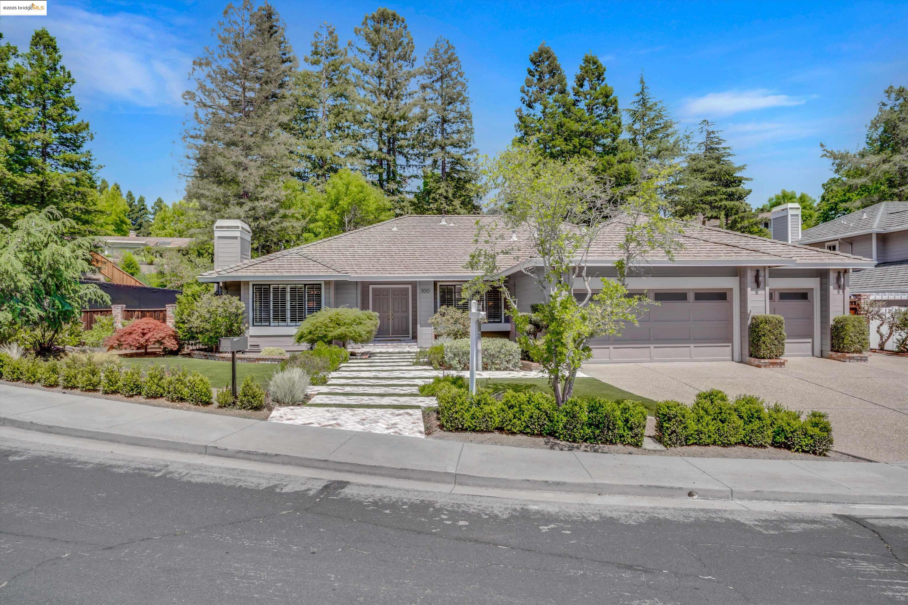 Discover the perfect blend of style, comfort, and location in this beautifully updated 4-bedroom, 2.5-bath home with approximately 2,775 sqft of living space. Situated on a 10,400 sqft lot in a private court of semi-custom homes, this gem lies in one of San Ramon's most desirable neighborhoods.  The bright, airy layout offers formal living and dining rooms, an expansive family room, and a stunning chef’s kitchen featuring Hestan appliances, quartz countertops, double ovens, built-in refrigerator, and custom cabinetry.  Natural light floods the home through large windows showcasing lush, landscaped grounds. Enjoy generously sized secondary bedrooms and a serene primary suite with dual walk-in closets and a spa-like remodeled bath.  Additional features include hardwood and tile flooring, multiple fireplaces, custom built-ins, wet bar, and ample storage. The backyard is a true oasis with mature trees, lush lawn, a private sports court, and space for entertaining.  Close to top-rated schools, parks, shopping, and commuter routes—300 Andros is the perfect place to call home.