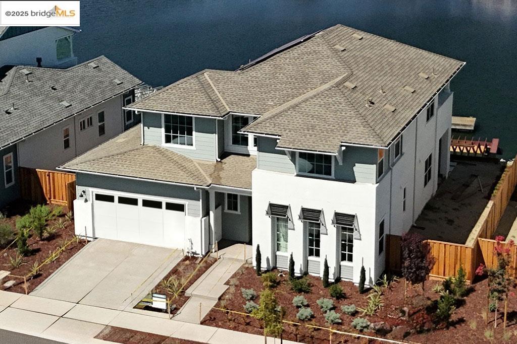 BRAND NEW CONSTRUCTION! No waiting opportunity to capture a Luxury Davidson Communities Home on deep Delta water with private boat dock in the Highly Sought-After Award-Winning Delta Coves Community! The Starboard offers an open concept floor plan that lives like a single-story with the primary bedroom & secondary bedroom on the main level with 2 additional bedrooms upstairs for family & guests. This home includes DESIGNER SELECTED FINISHES & decking from the back of the home out to your EXTENDED DECK for outdoor entertaining! Enjoy every moment of water living & water activities or just enjoy water views and sunsets over Mt. Diablo. Be ready for activities, entertaining & meeting neighbors at Island Camp where you can swim in the year-round heated pool, get a workout in at the gym, shoot pool in the club house, play Pickle Ball, get a sand volleyball game going or mingle at a community planned event. This gorgeous 4-bedroom home is well appointed with a 48" Kitchen Aid SS slide-in range, upgraded kitchen, neutral colors and ready for your personal touches. Pack your bags because this energy efficient home with SOLAR included is ready to move-in! Every Day is an Open House, just visit the Davidson Sales Office in the model complex and don't delay because this home won't last long