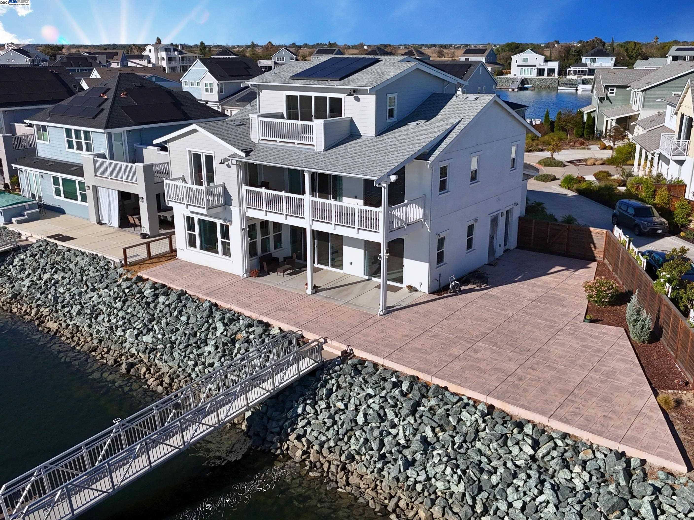 Wake up to one of the most breathtaking water views in the entire neighborhood, where the sun dances across the Delta and every evening feels like a front-row seat to nature’s show. This thoughtfully upgraded home boasts over $100,000 in enhancements, blending luxury and functionality with style. From the moment you step inside, you’ll notice the attention to detail and quality finishes that elevate everyday living. Beyond the home itself, what truly sets this location apart is the vibrant community spirit. Residents enjoy exclusive access to Island Camp with year-round events , where summer concerts, potlucks, and festive gatherings create a warm, welcoming atmosphere that’s hard to find elsewhere. Whether you're sipping coffee on the patio or joining neighbors for a sunset celebration, this is a place where connection and comfort come naturally.