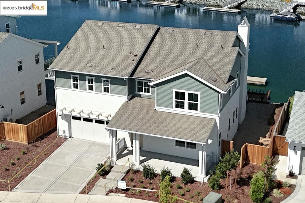 Brand New Construction - Great Location with vast water views & private boat dock! No waiting opportunity to capture a Luxury Davidson Collection Home on deep Delta water in the Highly Sought-After Award-Winning Delta Coves Community! The Boathouse offers an open concept floor plan with water views from the moment you enter through the front door. The luxurious Jr. Suite on the main level is perfect for visiting parents or guests, with 3 additional bedrooms upstairs including a grand primary suite with separate spa tub and walk-in tile shower. This home includes DESIGNER SELECTED FINISHES in neutral colors with a splash of navy to match the water-living feel. A Snack Alley behind your kitchen is great for entertaining or for your guests to grab a snack or refreshing drink from the outside covered veranda. Luxury decking flows from the great room out to the covered veranda and extended deck for water and sunset views. Be ready to meet neighbors at Island Camp where you can swim in the year-round heated lap pool, get a workout in the gym, shoot pool in the club house, play pickle ball, get a sand volleyball game going or mingle at a community planned event. This gorgeous 4-bedroom home is well appointed with a 48" Kitchen Aid SS slide-in range & SOLAR INCLUDED! Move-in ready!