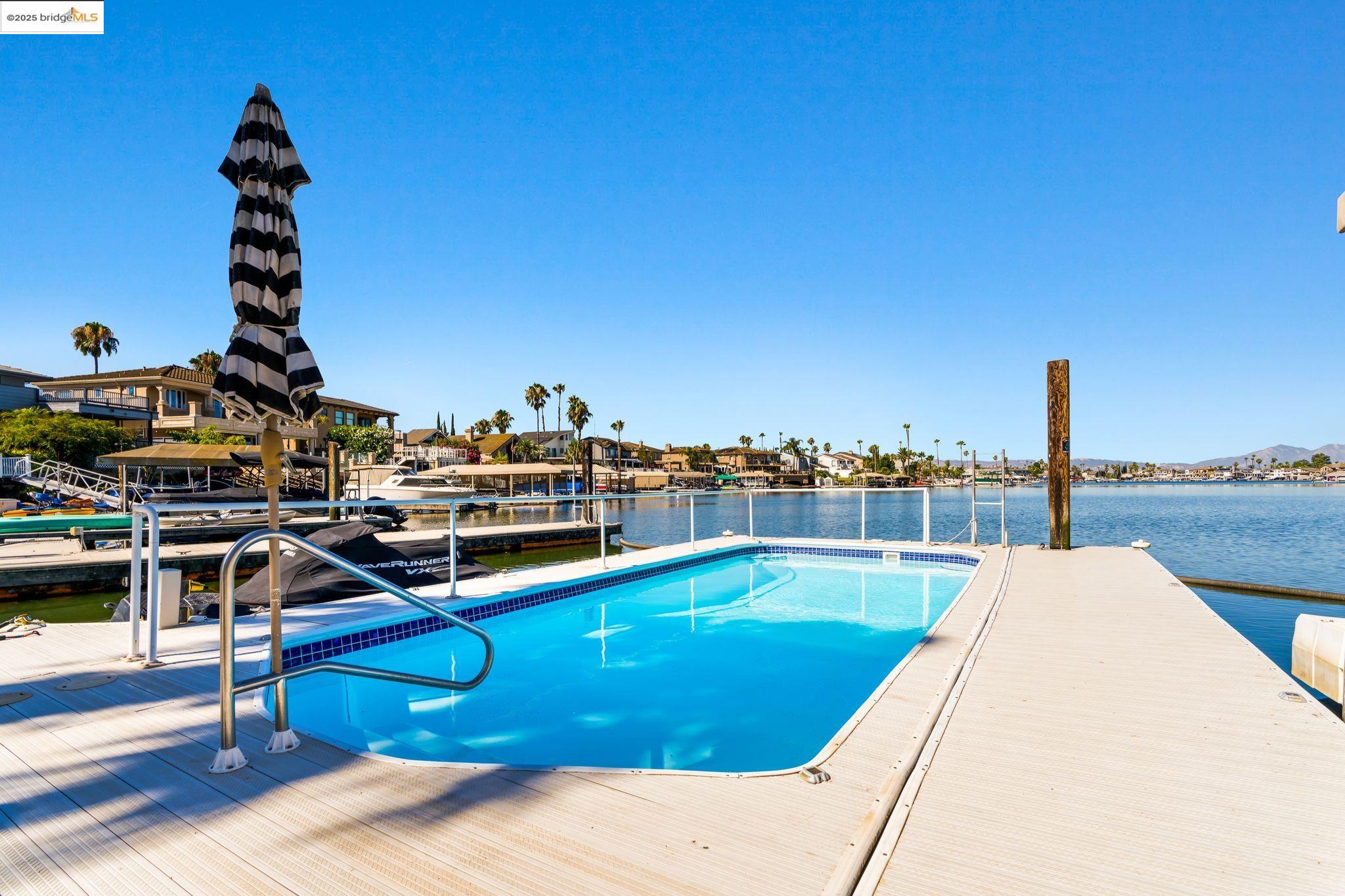 Welcome to 630 Discovery Bay Blvd, a true gem located in the highly sought-after Lido Bay. This exquisite three-bedroom, three-bathroom home is finely tuned with all the modern upgrades, making it the perfect blend of luxury and comfort. Step inside to discover a thoughtfully designed layout that maximizes space and natural light. The open concept living areas flow seamlessly, offering breathtaking views that stretch beyond the swimming pool and out to the sparkling waters of the bay. Picture yourself enjoying serene sunsets from the comfort of your balcony—one of the most outstanding views you can imagine!  The well-appointed kitchen features modern finishes and high-end appliances, ideal for culinary enthusiasts and entertaining guests. Each of the three bedrooms is spacious and inviting, providing a personal retreat for everyone in the household. Outside, the private swimming pool offers a refreshing escape, surrounded by lush landscaping and stunning vistas. Whether you’re lounging poolside or hosting gatherings, this outdoor space is perfect for enjoying the beautiful California weather. Located in Lido Bay, this property is not just a home; it’s a lifestyle. Experience the best of waterfront living with nearby amenities, recreational activities, and a vibrant community.